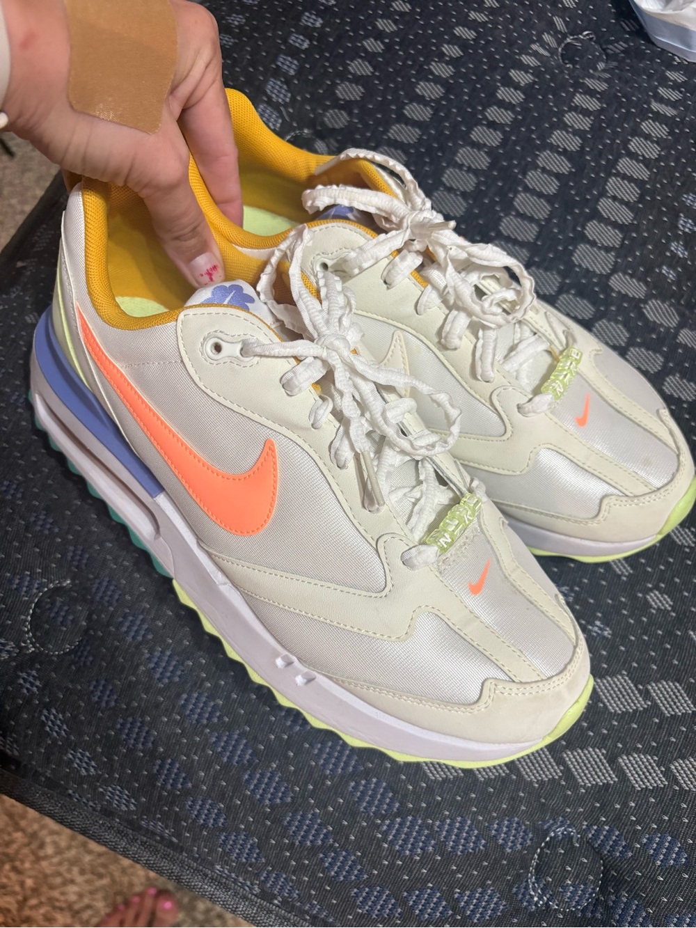 Nike Women Cream Sneakers with Orange Swoosh and Yellow Accents